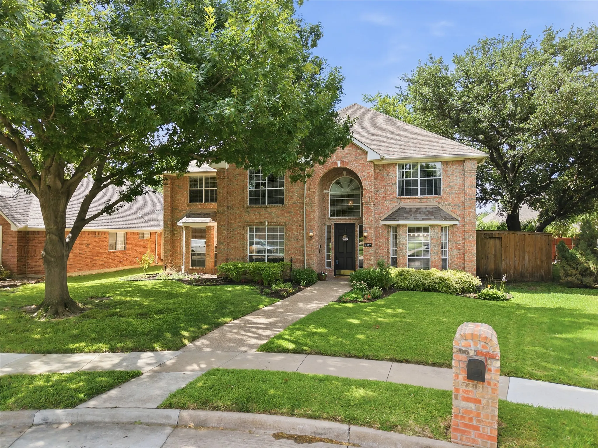 4112 Blackpool Drive, framed by mature trees