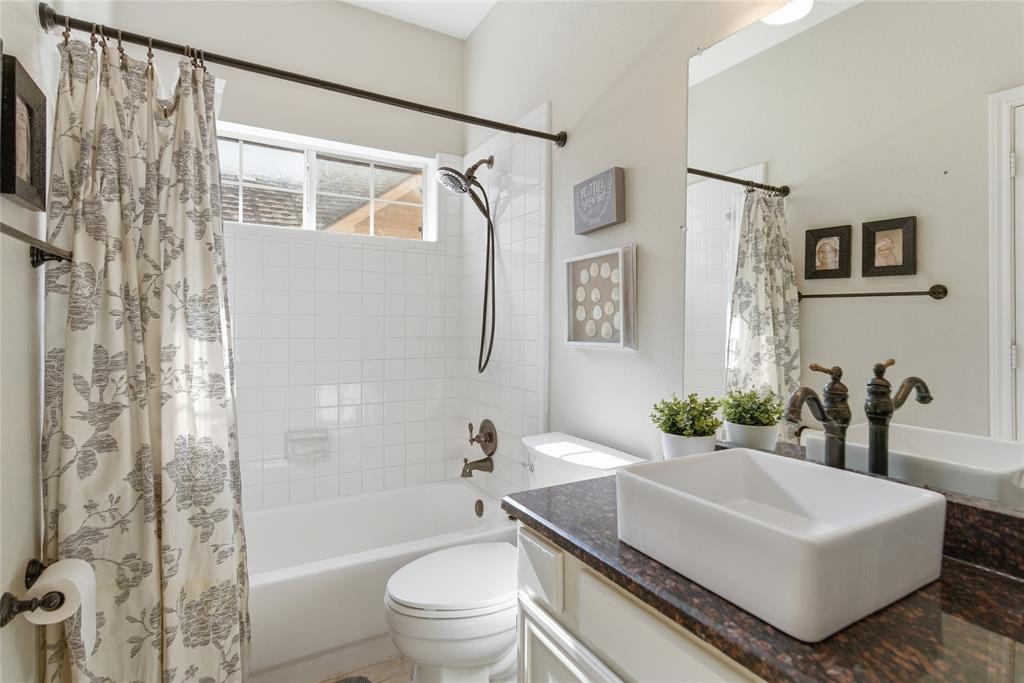 Bathroom with vanity and tub