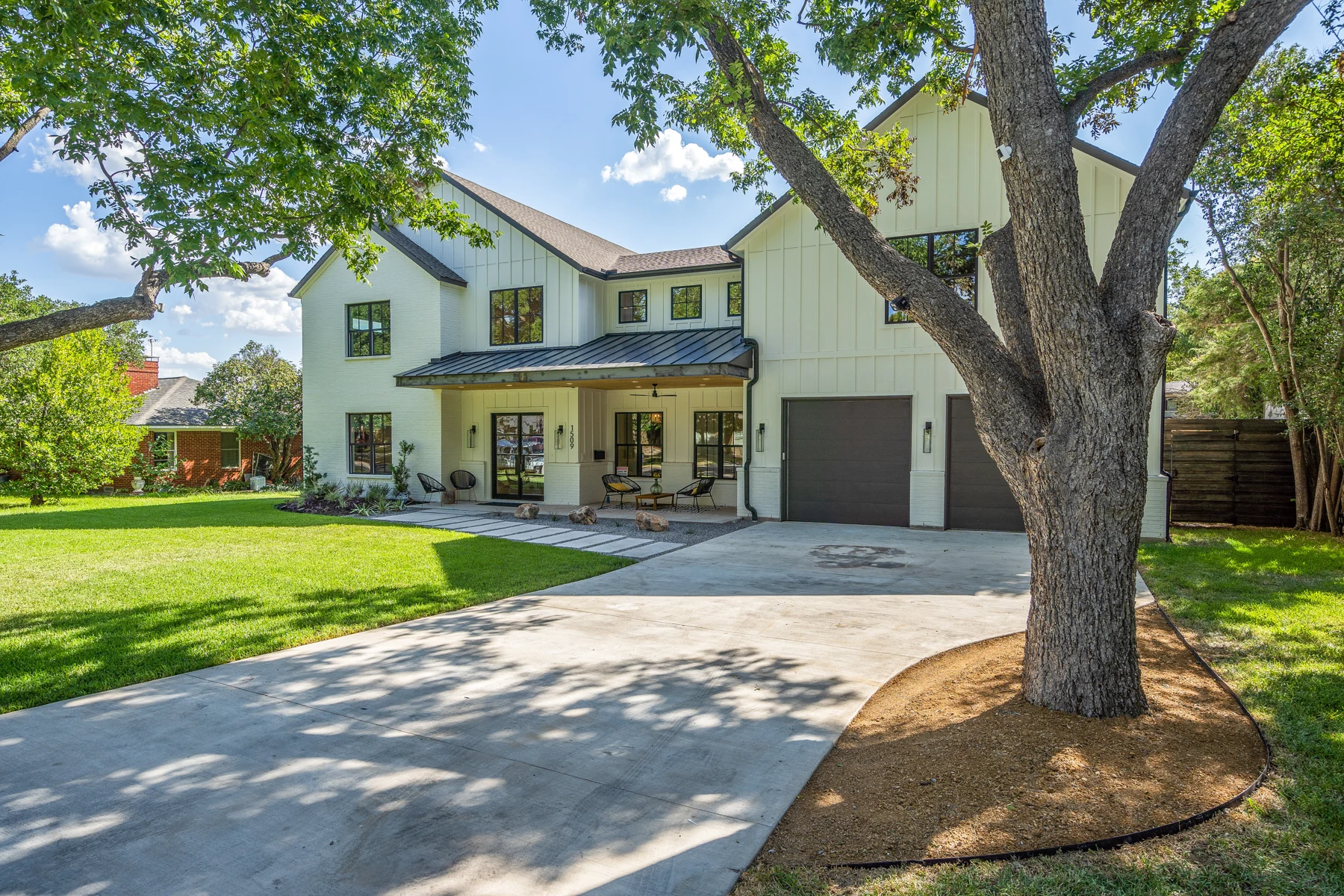 Front exterior of the modern farmhouse at 1509 El Campo in Dallas