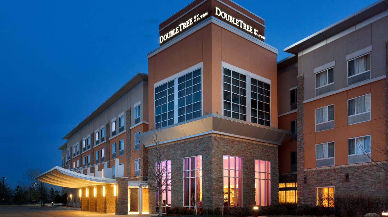 DoubleTree by Hilton Hotel Oklahoma City Airport illuminated at dusk